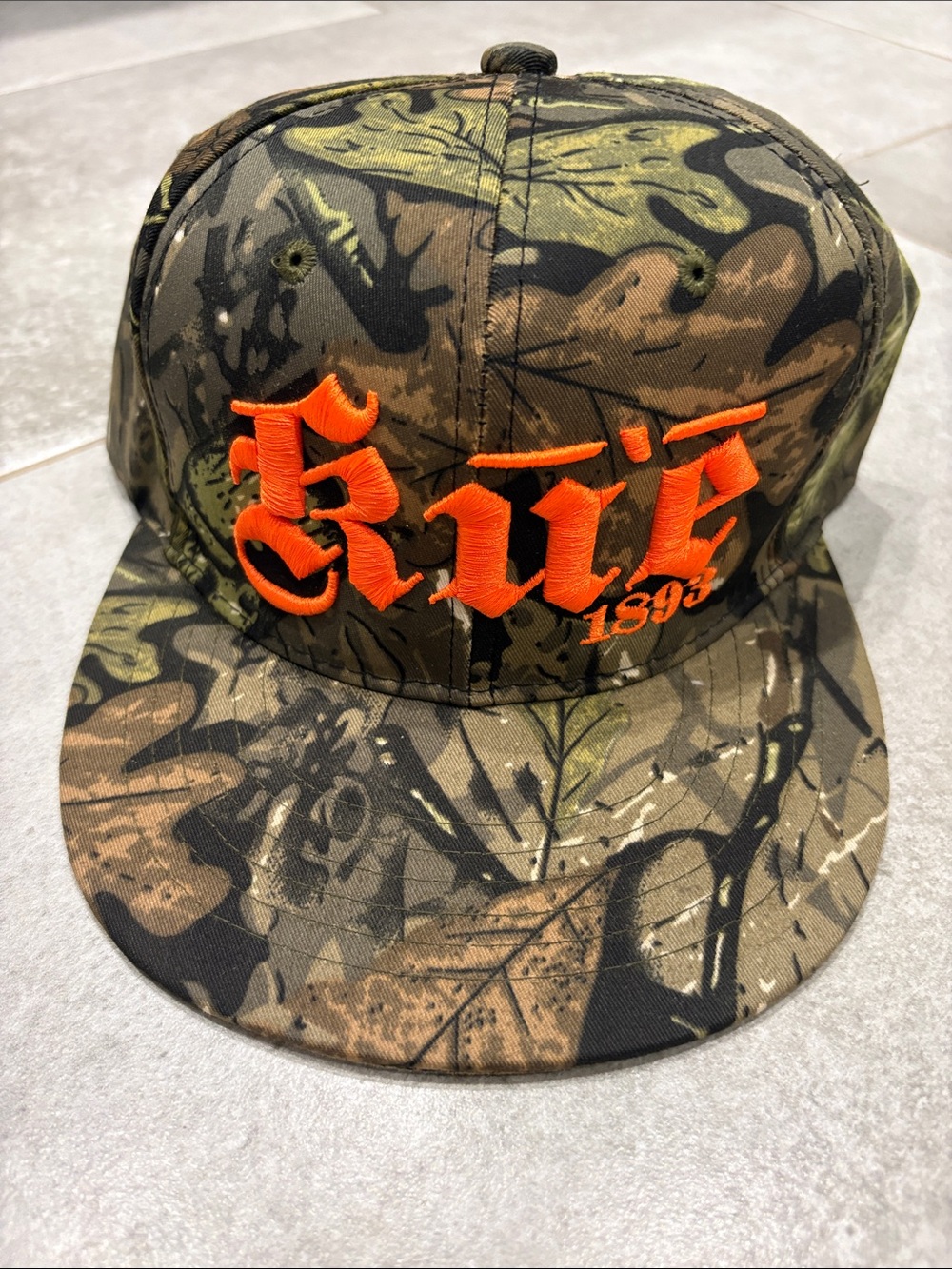 Ku’e Camo Snapback Hat with Orange Embroidery
